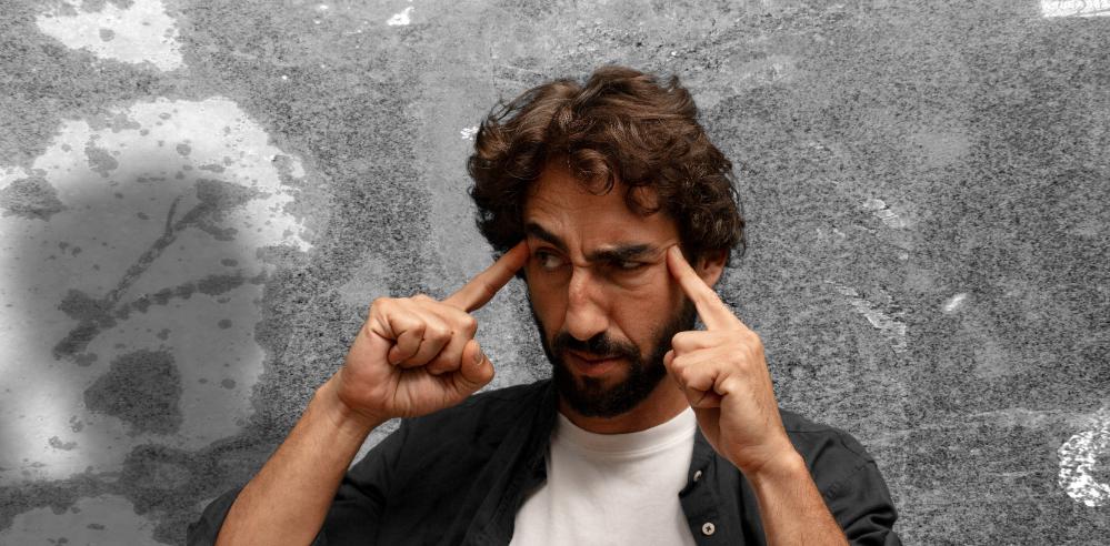 Professional man at work looking stressed, representing the moment one income stream stops feeling safe