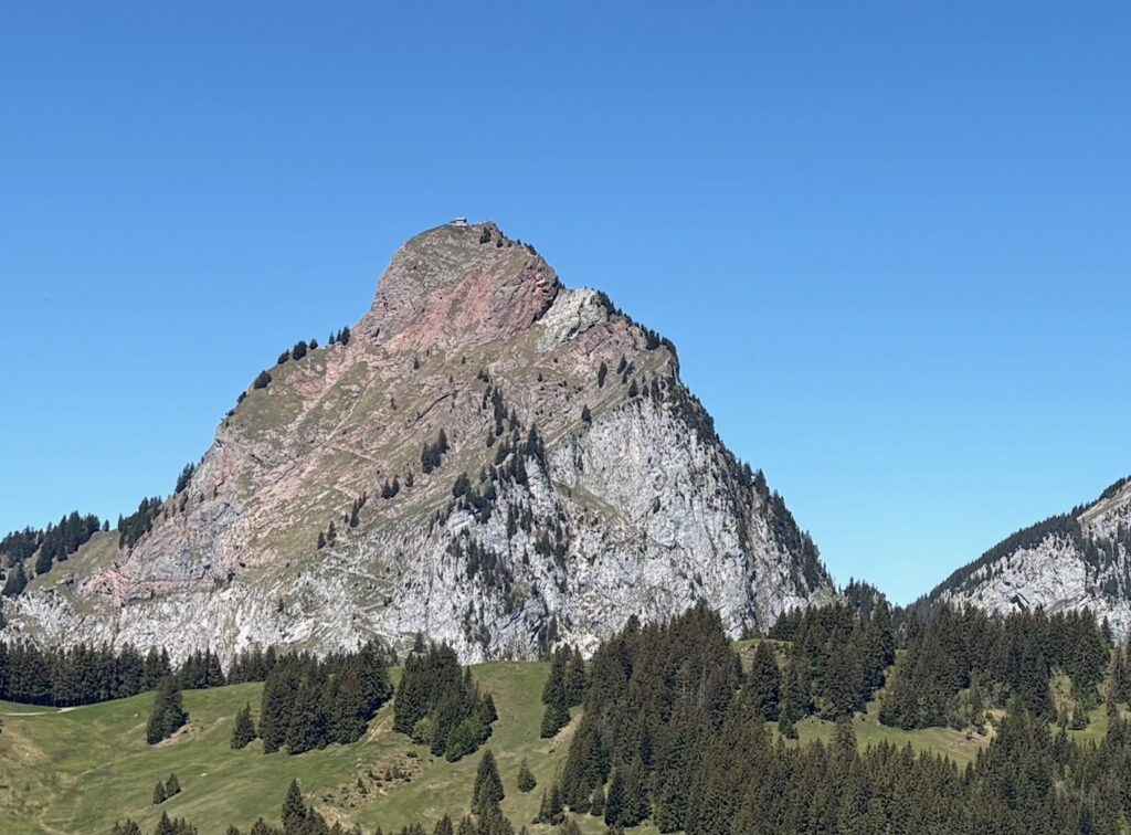 Steep Swiss mountain trail illustrating how modern life and multiple income streams can feel exhausting and fragile.